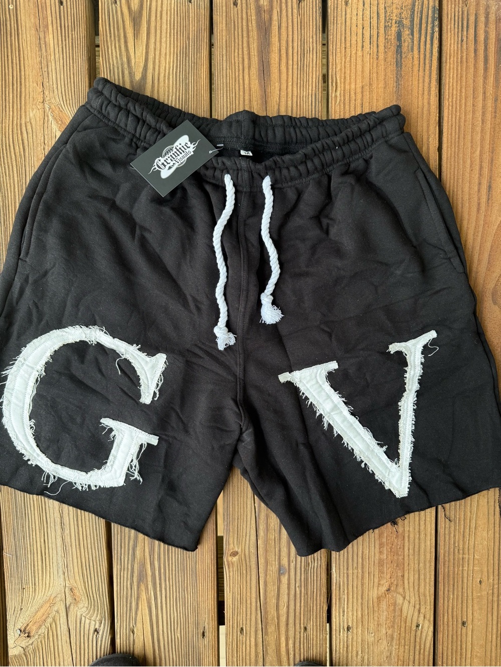 “GV” Distressed embroidered shorts